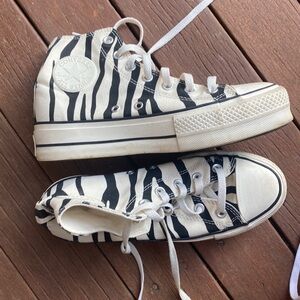 Chuck Taylor all star zebra high top converse sneakers.